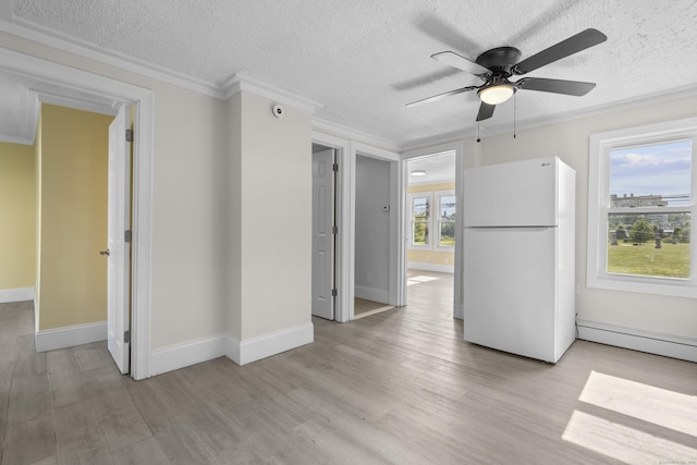 237 Helen St, Bridgeport, CT 06608 - empty room with ceiling fan, light wood finished floors, a textured ceiling, crown molding, and baseboard heating