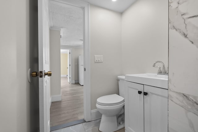 237 Helen St, Bridgeport, CT 06608 - half bathroom with vanity, tile patterned flooring, and a textured ceiling