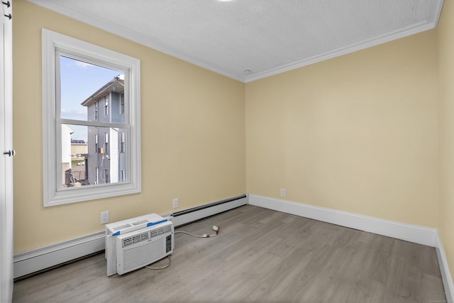 237 Helen St, Bridgeport, CT 06608 - spare room with wood finished floors, a baseboard radiator, ornamental molding, and a textured ceiling