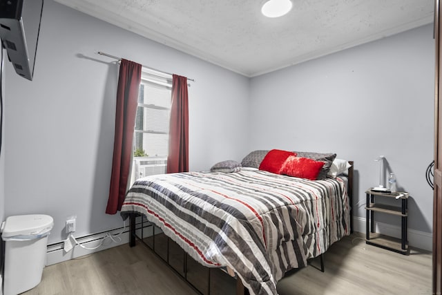 237 Helen St, Bridgeport, CT 06608 - bedroom with wood finished floors, a textured ceiling, and cooling unit