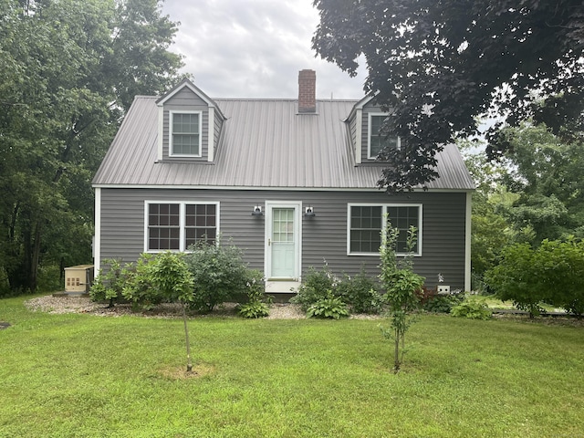 57 S Main St, East Granby, CT 06026 - cape cod home featuring a chimney, a metal roof, and a front lawn