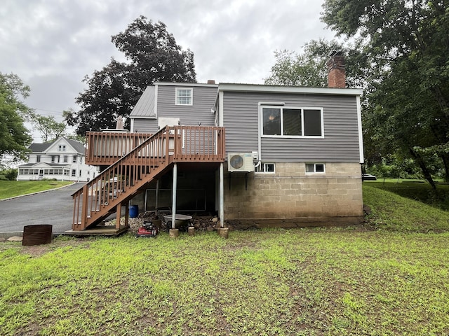 57 S Main St, East Granby, CT 06026 - rear view of property with stairs, a chimney, a deck, and a lawn