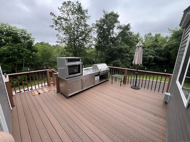 57 S Main St, East Granby, CT 06026 - deck with exterior kitchen and view of wooded area
