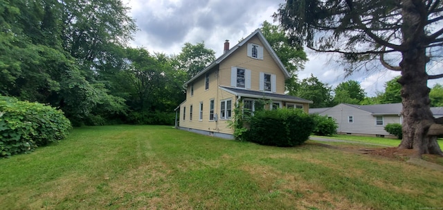 19 Cook Hill Rd, Windsor, CT 06095 - back of property featuring a chimney and a yard