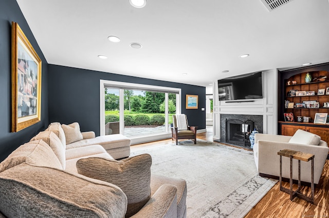 10 Prynne Ridge Rd, Longmeadow, MA 01106 - living area featuring wood finished floors, a fireplace, and recessed lighting