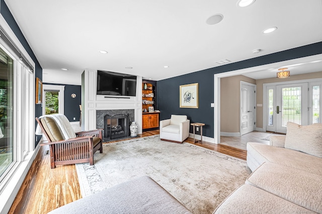 10 Prynne Ridge Rd, Longmeadow, MA 01106 - living area featuring a high end fireplace, light wood finished floors, and recessed lighting