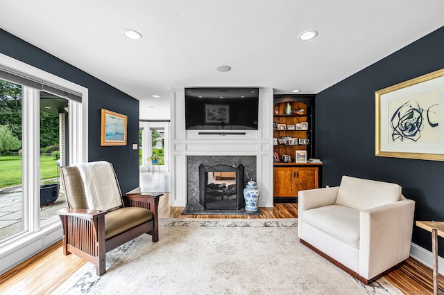 10 Prynne Ridge Rd, Longmeadow, MA 01106 - living area featuring wood finished floors, a premium fireplace, and recessed lighting