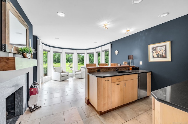 10 Prynne Ridge Rd, Longmeadow, MA 01106 - kitchen with a high end fireplace, open floor plan, light brown cabinets, healthy amount of natural light, and recessed lighting