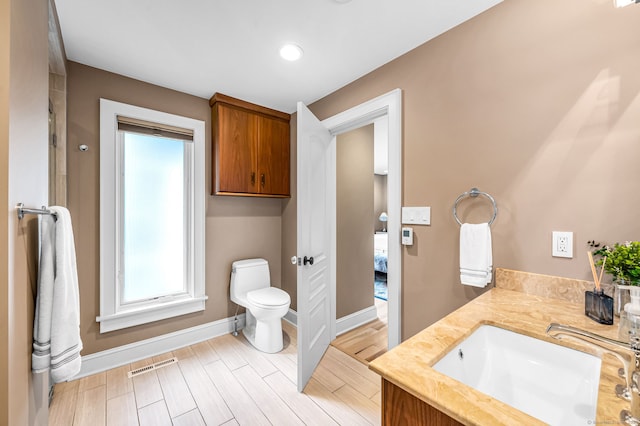 10 Prynne Ridge Rd, Longmeadow, MA 01106 - ensuite bathroom with vanity, wood tiled floors, and recessed lighting