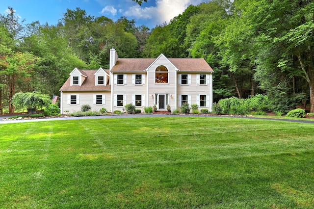 11 Sweetbriar Ln, Newtown, CT 06482 - colonial inspired home with a chimney, a front yard, and a shingled roof