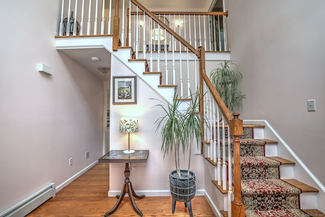 11 Sweetbriar Ln, Newtown, CT 06482 - stairs featuring a baseboard heating unit and wood finished floors