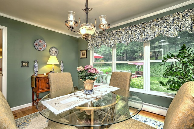 11 Sweetbriar Ln, Newtown, CT 06482 - dining space featuring wood finished floors, crown molding, baseboard heating, and a chandelier