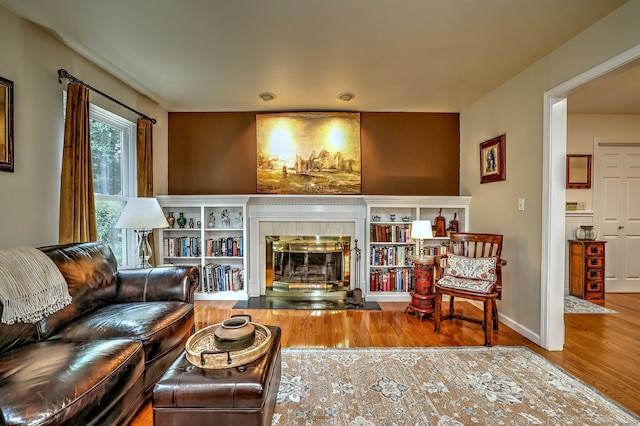 11 Sweetbriar Ln, Newtown, CT 06482 - living area featuring wood finished floors and a tile fireplace