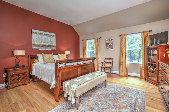 11 Sweetbriar Ln, Newtown, CT 06482 - bedroom featuring light wood-type flooring, vaulted ceiling, a baseboard heating unit, and a baseboard radiator