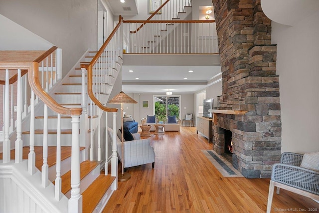 6 Tonetta Cir, Norwalk, CT 06855 - stairway with wood finished floors, a high ceiling, and crown molding