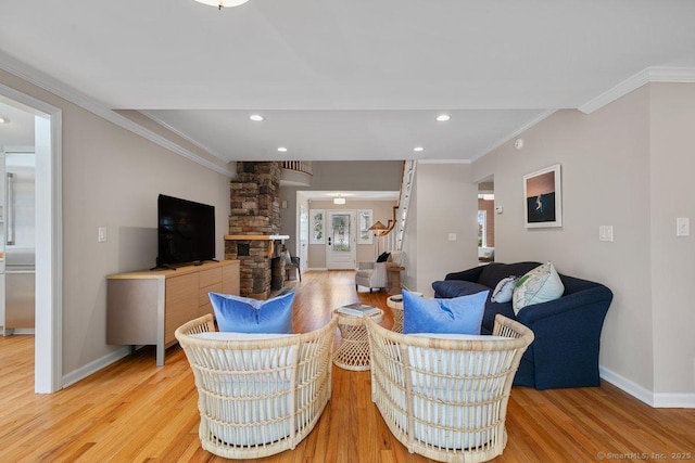 6 Tonetta Cir, Norwalk, CT 06855 - living area featuring light wood finished floors, crown molding, and recessed lighting