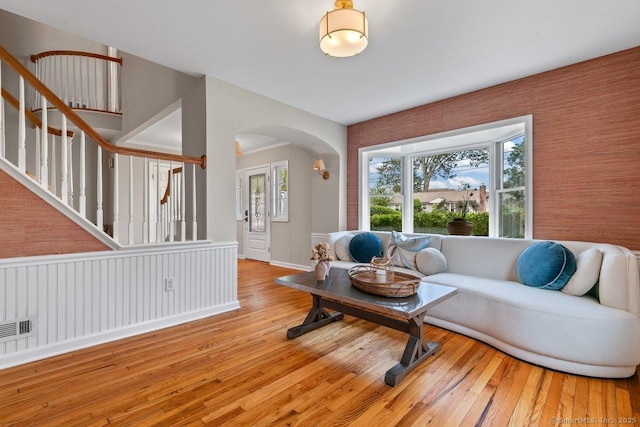 6 Tonetta Cir, Norwalk, CT 06855 - living area with stairway, arched walkways, and hardwood / wood-style floors