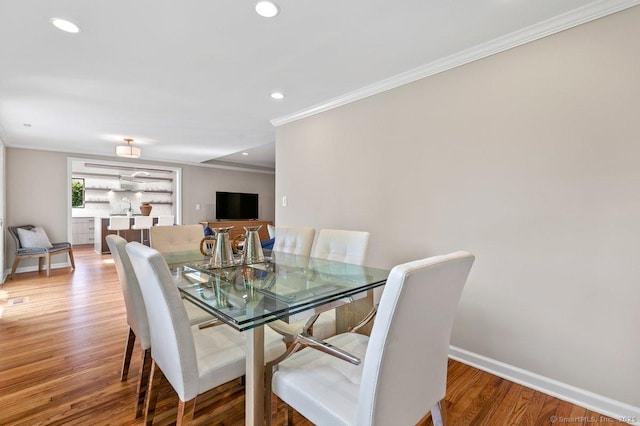 6 Tonetta Cir, Norwalk, CT 06855 - dining area featuring crown molding, light wood finished floors, and recessed lighting