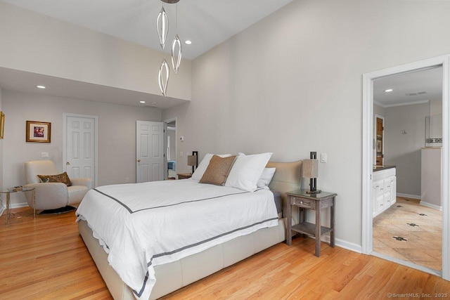 6 Tonetta Cir, Norwalk, CT 06855 - bedroom with recessed lighting, a towering ceiling, light wood-style floors, and connected bathroom