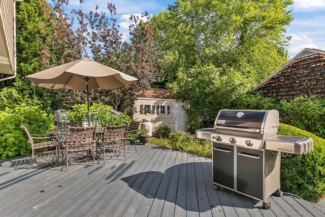 6 Tonetta Cir, Norwalk, CT 06855 - wooden terrace with area for grilling, outdoor dining space, and an outbuilding