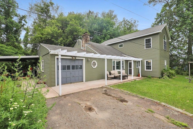 30 Lake Rd, Columbia, CT 06237 - view of front of property featuring asphalt driveway, a garage, a front yard, a chimney, and a pergola