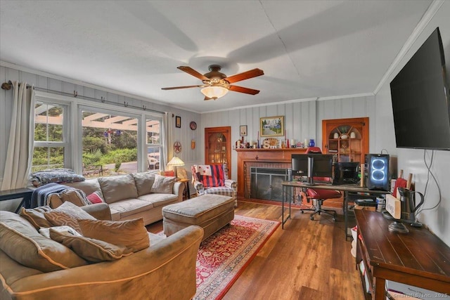 30 Lake Rd, Columbia, CT 06237 - living room featuring crown molding, wood finished floors, ceiling fan, a brick fireplace, and a desk