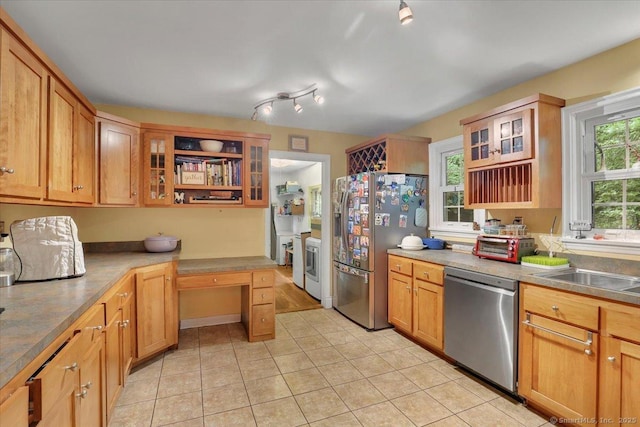 30 Lake Rd, Columbia, CT 06237 - kitchen featuring appliances with stainless steel finishes, light tile patterned flooring, glass insert cabinets, built in study area, and track lighting