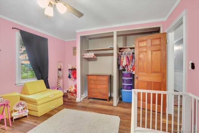30 Lake Rd, Columbia, CT 06237 - bedroom with crown molding, wood finished floors, a ceiling fan, and a closet