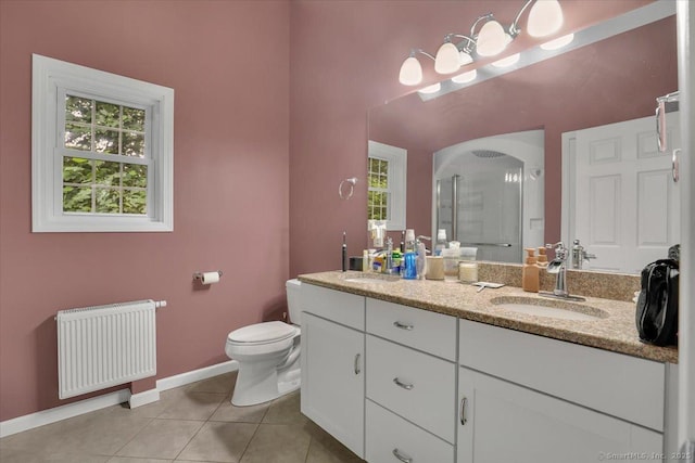 30 Lake Rd, Columbia, CT 06237 - full bath with radiator, double vanity, a shower stall, tile patterned flooring, and plenty of natural light