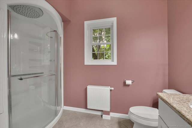 30 Lake Rd, Columbia, CT 06237 - full bath featuring radiator heating unit, a shower stall, vanity, and tile patterned floors