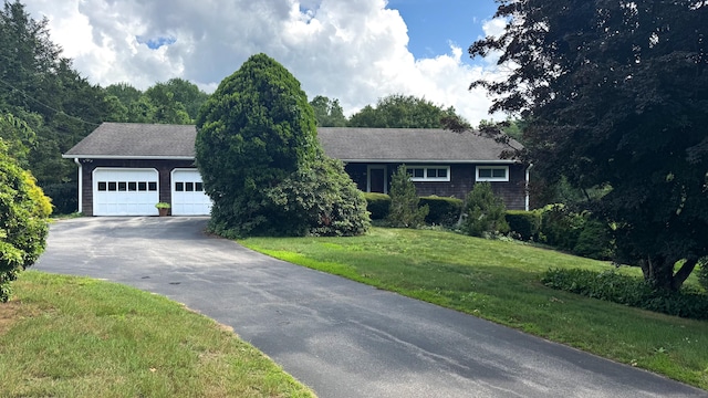 70 River Rd, Preston, CT 06365 - ranch-style house featuring asphalt driveway, a garage, and a front yard