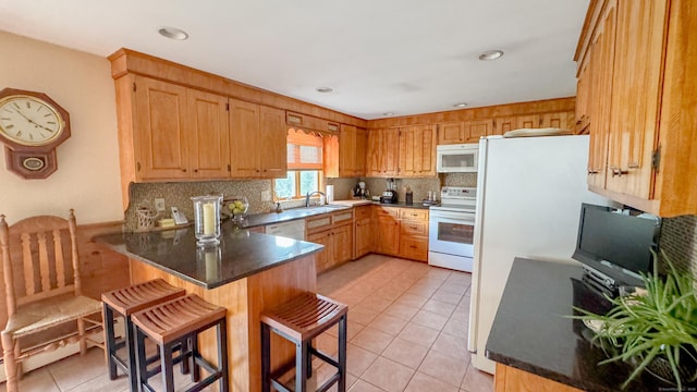 70 River Rd, Preston, CT 06365 - kitchen with white appliances, a peninsula, light tile patterned flooring, decorative backsplash, and a kitchen breakfast bar