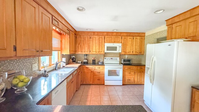 70 River Rd, Preston, CT 06365 - kitchen featuring white appliances, light tile patterned floors, tasteful backsplash, dark countertops, and recessed lighting