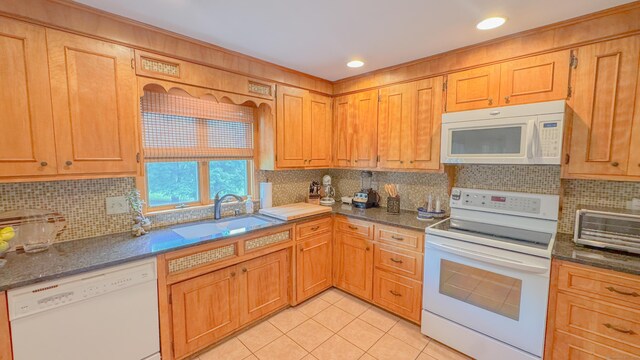 70 River Rd, Preston, CT 06365 - kitchen with white appliances, light tile patterned floors, tasteful backsplash, dark stone countertops, and recessed lighting