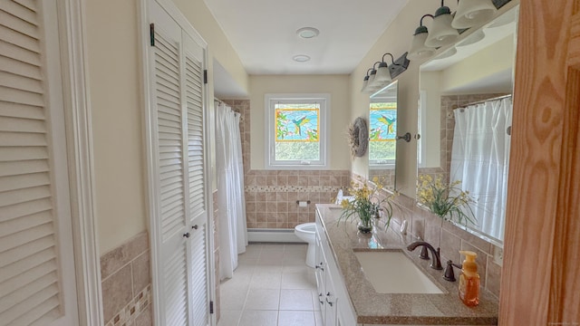 70 River Rd, Preston, CT 06365 - bathroom featuring a closet, tile walls, tile patterned floors, vanity, and wainscoting