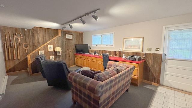 70 River Rd, Preston, CT 06365 - living room featuring wood walls, rail lighting, a wainscoted wall, and light tile patterned floors