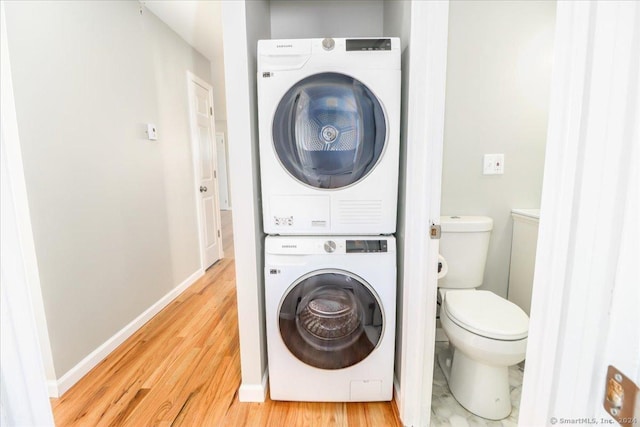 18 Greenbrier Rd, East Hartford, CT 06118 - laundry room featuring stacked washer / dryer and light wood finished floors