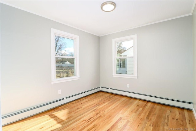 18 Greenbrier Rd, East Hartford, CT 06118 - spare room featuring ornamental molding, a baseboard heating unit, and wood finished floors