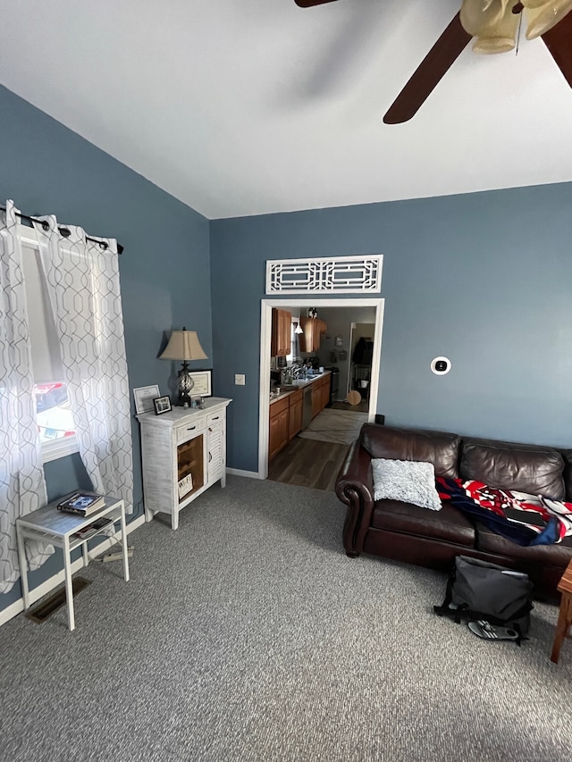 699 Main St, Watertown, CT 06779 - living area with a ceiling fan and dark carpet