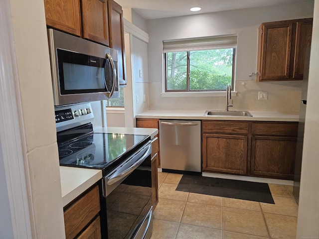 29 Great Meadow Ln Unit 29, Farmington, CT 06001 - kitchen with stainless steel appliances, light countertops, light tile patterned floors, and recessed lighting