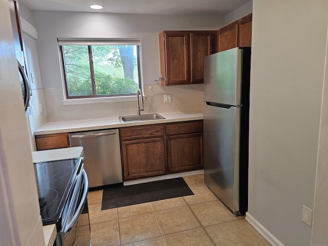 29 Great Meadow Ln Unit 29, Farmington, CT 06001 - kitchen with stainless steel appliances, light countertops, light tile patterned floors, and recessed lighting