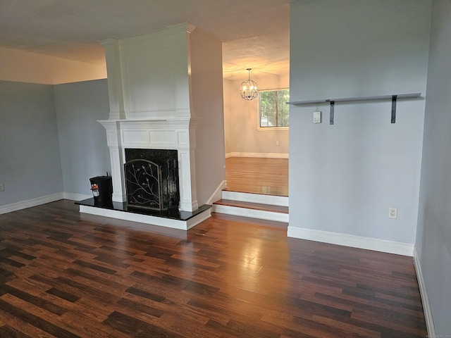 29 Great Meadow Ln Unit 29, Farmington, CT 06001 - unfurnished living room with dark wood-type flooring, a premium fireplace, and a chandelier