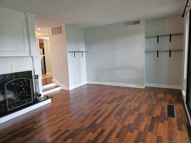 29 Great Meadow Ln Unit 29, Farmington, CT 06001 - unfurnished living room featuring dark wood-style floors and a fireplace with raised hearth