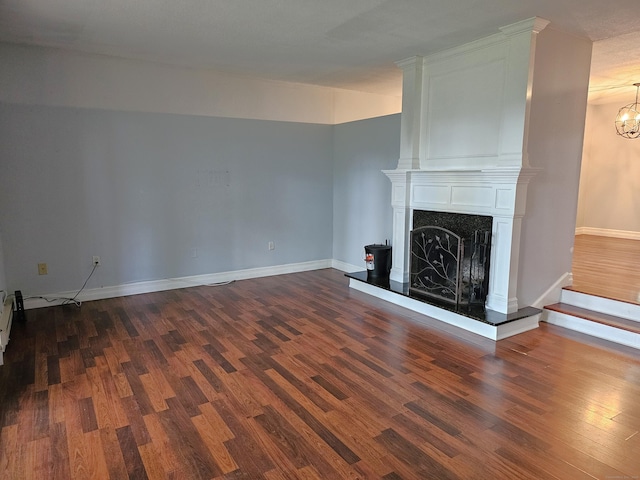 29 Great Meadow Ln Unit 29, Farmington, CT 06001 - unfurnished living room with dark wood-style floors, a fireplace, and a chandelier