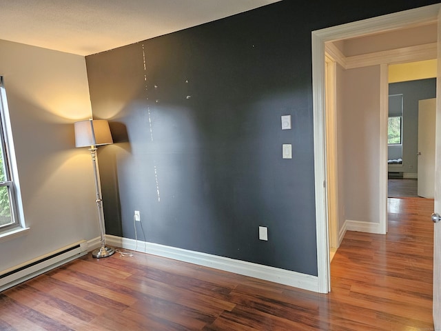 29 Great Meadow Ln Unit 29, Farmington, CT 06001 - empty room with a baseboard heating unit and wood finished floors