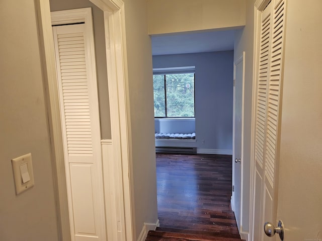 29 Great Meadow Ln Unit 29, Farmington, CT 06001 - hallway with dark wood finished floors and a baseboard radiator