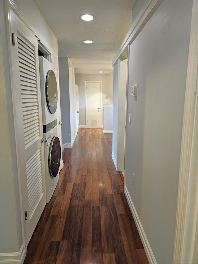 29 Great Meadow Ln Unit 29, Farmington, CT 06001 - hall featuring stacked washing machine and dryer, dark wood-type flooring, and recessed lighting