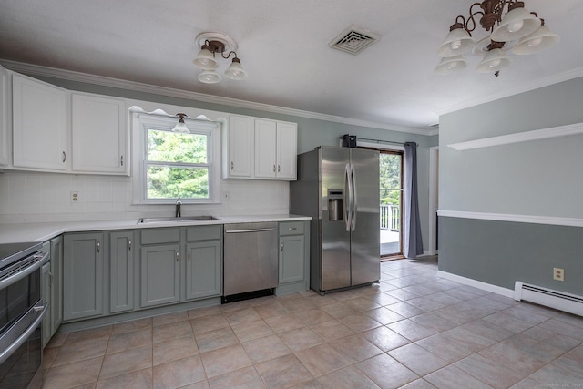 21 Brentwood Rd, New Milford, CT 06776 - kitchen featuring appliances with stainless steel finishes, tasteful backsplash, a chandelier, gray cabinetry, and light countertops