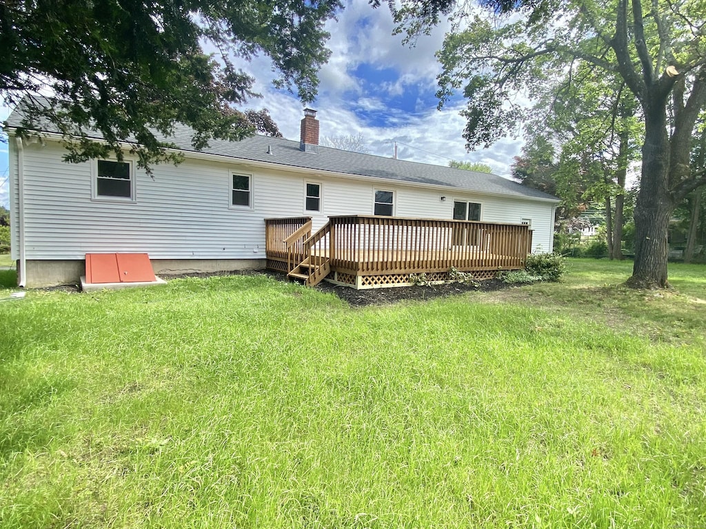 475 Oceanview Ter, Stratford, CT 06614 - rear view of property with a deck, a chimney, and a yard