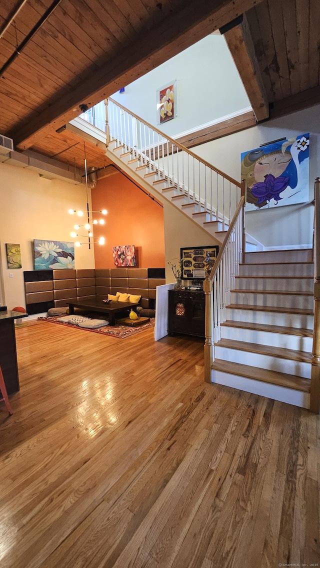 33 Mechanic St Unit 203, Windsor, CT 06095 - living area with stairway, wood finished floors, and a wood ceiling with exposed beams